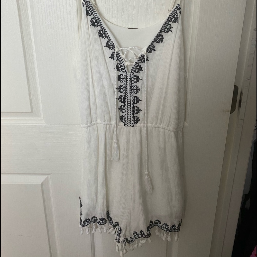 White and navy pattered romper with tassels